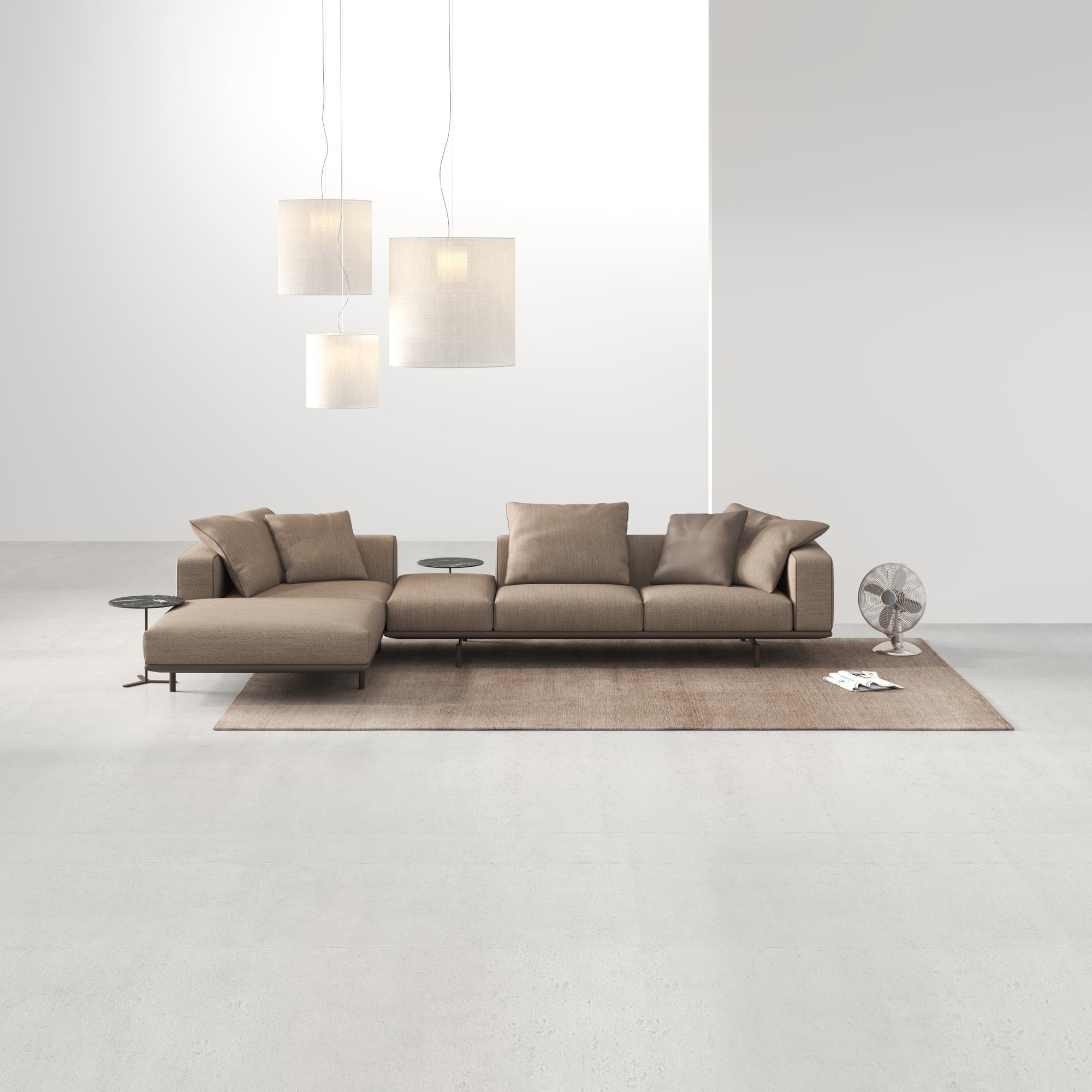 WEIBELWEIBEL LENTO Sofa mit Hockern in einem hellen Raum